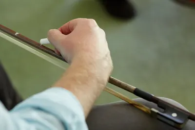 Close-up of a student’s bow hold